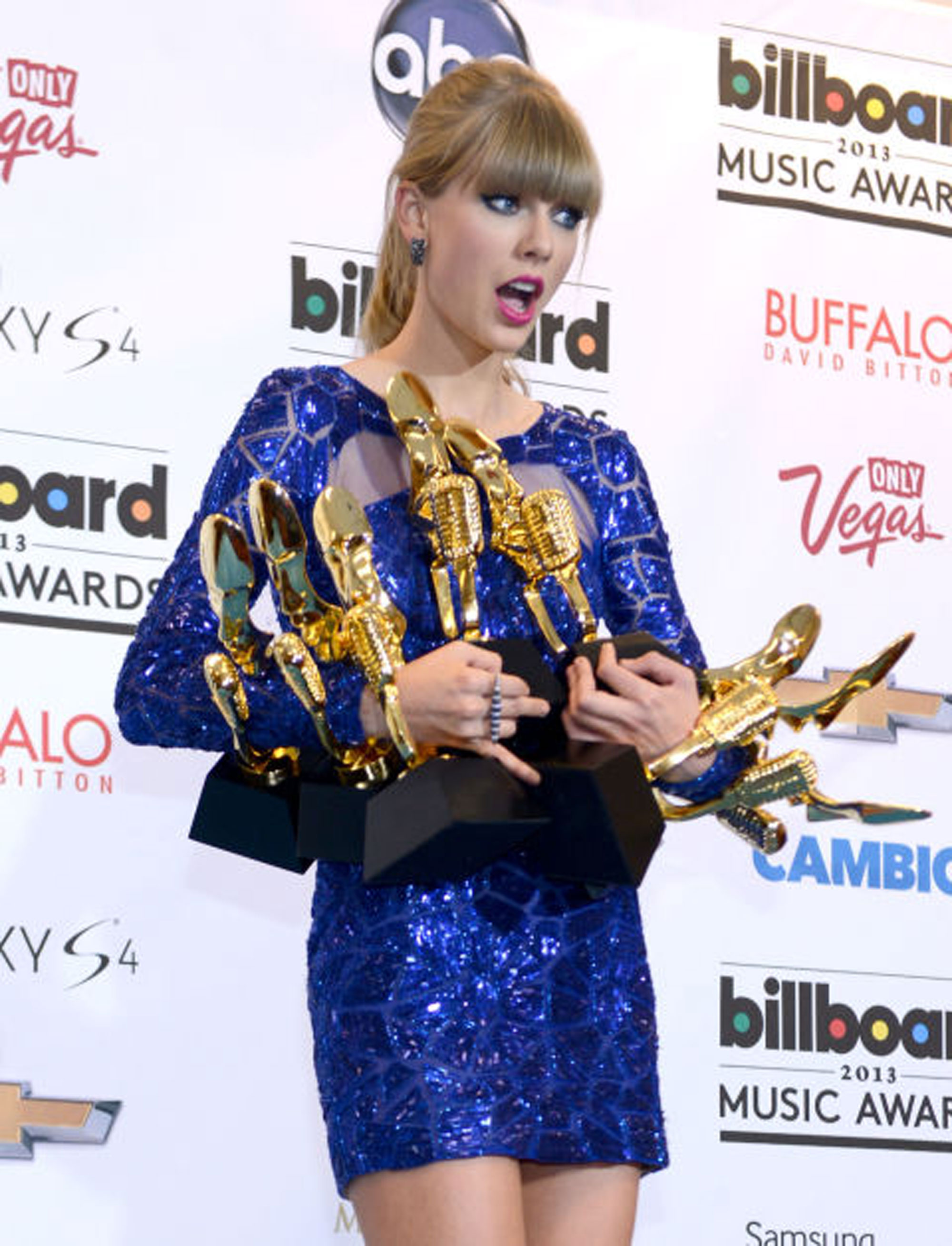 15 times Taylor Swift won so many awards she could barely hold them all