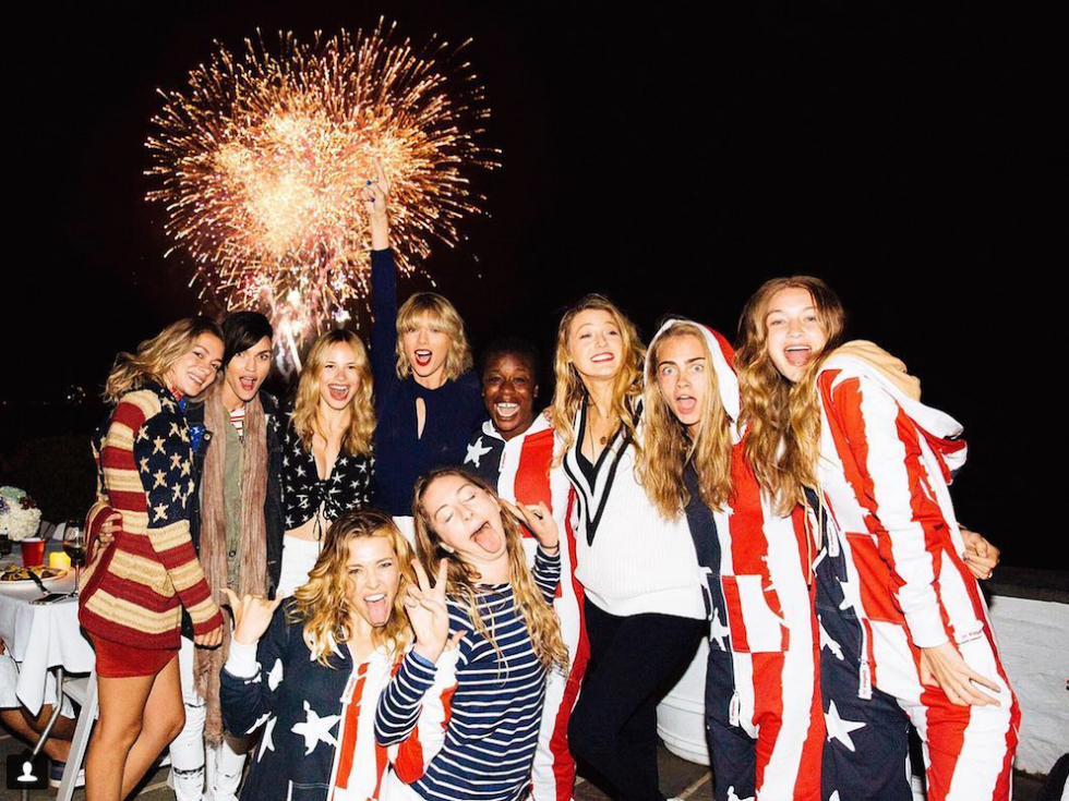 Here's Taylor Swift and Her Squad Sliding Down An Inflatable